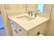 A bathroom vanity with a stone countertop and neutral color scheme at 13613 W Cypress St, Goodyear, AZ 85395