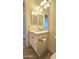 Bathroom featuring quartz countertop, undermount sink, and tile flooring at 13613 W Cypress St, Goodyear, AZ 85395