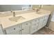 Dual sink bathroom vanity with solid countertops and stainless faucets at 13613 W Cypress St, Goodyear, AZ 85395