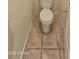 Small bathroom with toilet and tile flooring at 13613 W Cypress St, Goodyear, AZ 85395