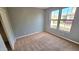 Bright bedroom with neutral carpet and large windows at 13613 W Cypress St, Goodyear, AZ 85395