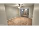 Spacious bedroom with carpet and mirrored closet doors at 13613 W Cypress St, Goodyear, AZ 85395