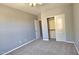 Neutral bedroom with ceiling fan, closet, and ensuite bath access at 13613 W Cypress St, Goodyear, AZ 85395
