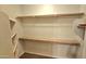 Walk-in closet with shelves and hanging rods at 13613 W Cypress St, Goodyear, AZ 85395