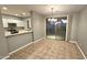 Dining area with tile floor and sliding door to patio at 13613 W Cypress St, Goodyear, AZ 85395