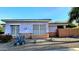 House with light purple stucco exterior and desert landscaping at 13613 W Cypress St, Goodyear, AZ 85395