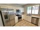 Kitchen with stainless steel appliances and white cabinets at 13613 W Cypress St, Goodyear, AZ 85395