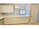 Kitchen counter and bar top for entertaining, with a view of the living room at 13613 W Cypress St, Goodyear, AZ 85395