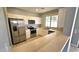 Kitchen with stainless steel appliances and an island at 13613 W Cypress St, Goodyear, AZ 85395