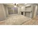 Living room with carpet, fireplace and neutral walls at 13613 W Cypress St, Goodyear, AZ 85395