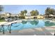 Community pool with lounge chairs and umbrellas at 13613 W Cypress St, Goodyear, AZ 85395