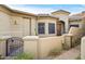 Tan stucco exterior with gated courtyard entry and pathway at 16413 E Westwind Ct, Fountain Hills, AZ 85268