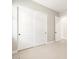 A bedroom featuring neutral walls, carpet and a closet with sliding doors at 17648 W Pierson St, Goodyear, AZ 85395