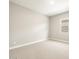 A bedroom featuring neutral walls, carpet and a window with blinds at 17648 W Pierson St, Goodyear, AZ 85395