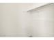 A white closet with a single bar for hanging clothes at 17648 W Pierson St, Goodyear, AZ 85395
