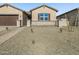 Well-maintained home with a gated front yard and low-maintenance desert landscaping at 17648 W Pierson St, Goodyear, AZ 85395