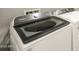 Close-up of modern Whirlpool washing machine and dryer in the laundry room at 17648 W Pierson St, Goodyear, AZ 85395