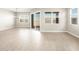 Open living space with sliding doors and an abundance of natural light at 17648 W Pierson St, Goodyear, AZ 85395