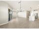 Open-concept living space with a modern kitchen and access to the outdoor patio at 17648 W Pierson St, Goodyear, AZ 85395