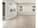 Spacious living space with bright windows and tile flooring at 17648 W Pierson St, Goodyear, AZ 85395