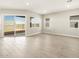 Bright living space with tile floors, sliding doors, and lots of natural light at 17648 W Pierson St, Goodyear, AZ 85395