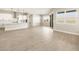 Open-concept living space with a modern kitchen and sliding glass doors at 17648 W Pierson St, Goodyear, AZ 85395