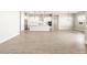 Bright, open living space with a modern kitchen and neutral decor at 17648 W Pierson St, Goodyear, AZ 85395