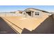 Expansive backyard with block fencing and covered patio, ready for landscaping at 17737 W Elm St, Goodyear, AZ 85395
