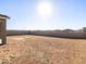 Large, level backyard with block fencing, perfect for creating an outdoor oasis at 17737 W Elm St, Goodyear, AZ 85395