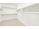 Walk-in closet with multiple rods and shelves at 17737 W Elm St, Goodyear, AZ 85395