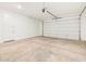 Spacious two-car garage with concrete floors and an automatic door opener at 17737 W Elm St, Goodyear, AZ 85395