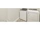 Modern laundry room featuring a new washer and dryer set and neutral paint at 17737 W Elm St, Goodyear, AZ 85395