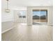 Open living space featuring modern light fixtures and sliding patio doors at 17737 W Elm St, Goodyear, AZ 85395