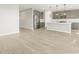 Open living space with stainless steel refrigerator and kitchen island at 17737 W Elm St, Goodyear, AZ 85395