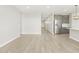 Neutral living space with tile flooring, leading to front entrance at 17737 W Elm St, Goodyear, AZ 85395
