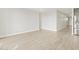 Neutral living space with tile flooring adjacent to stainless steel refrigerator at 17737 W Elm St, Goodyear, AZ 85395