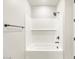 A modern bathroom features a tub and shower with white subway tile at 17749 W Elm St, Goodyear, AZ 85395