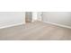 Bedroom featuring neutral carpeting, base molding, and a doorway leading to the hallway at 17749 W Elm St, Goodyear, AZ 85395