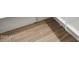 Close-up of stylish, light-colored wood-look tile flooring in a well-lit space at 17749 W Elm St, Goodyear, AZ 85395