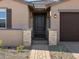 Welcoming front entrance with a decorative gate and stone accents at 17749 W Elm St, Goodyear, AZ 85395