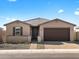 Charming single-story home with a two-car garage and desert landscaping at 17749 W Elm St, Goodyear, AZ 85395