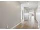 Bright hallway featuring wood-look tile floors at 17749 W Elm St, Goodyear, AZ 85395
