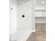 Walk-in shower featuring marble wall tile, tile flooring, and a glass enclosure at 17749 W Elm St, Goodyear, AZ 85395