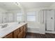 Bathroom with double vanity, soaking tub, and shower at 2526 W Woburn Ln, Phoenix, AZ 85085