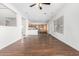 Open concept living room with kitchen view and wood flooring at 2526 W Woburn Ln, Phoenix, AZ 85085