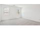 Bright bedroom with neutral carpet and two windows offering natural light at 47267 W Mellen Ln, Maricopa, AZ 85139