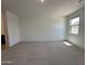 Bright bedroom with large window and plush carpet flooring providing a comfortable living space at 47267 W Mellen Ln, Maricopa, AZ 85139