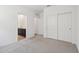 Neutral bedroom featuring access to the ensuite bathroom and a large closet at 47267 W Mellen Ln, Maricopa, AZ 85139