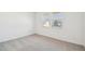 An empty bedroom with two windows lets in lots of light at 47267 W Mellen Ln, Maricopa, AZ 85139