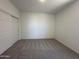 Carpeted bedroom featuring a large closet and neutral walls for a comfortable, customizable space at 47267 W Mellen Ln, Maricopa, AZ 85139